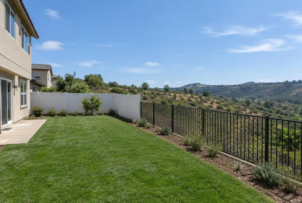 Typical Stevenson Ranch backyard with a white vinyl fence
